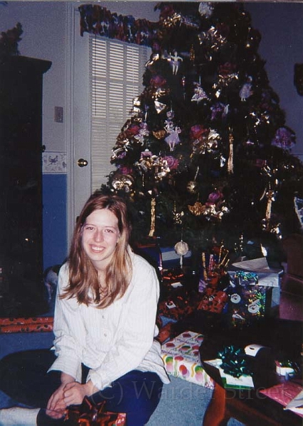 Erica In Front Of Xmas Tree.jpg